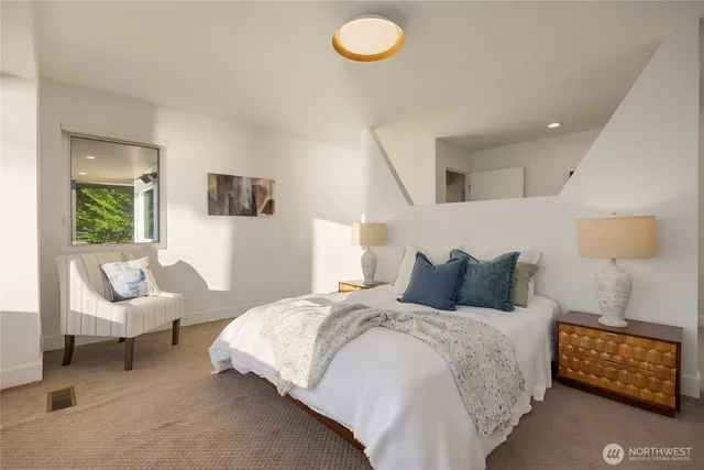 a bedroom with bed and window