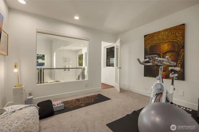 a living room with a couch and a wooden floor