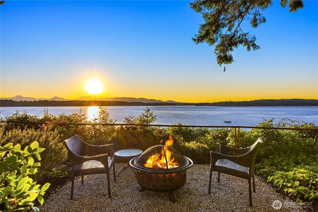 a view of a chairs and table on the terrace
