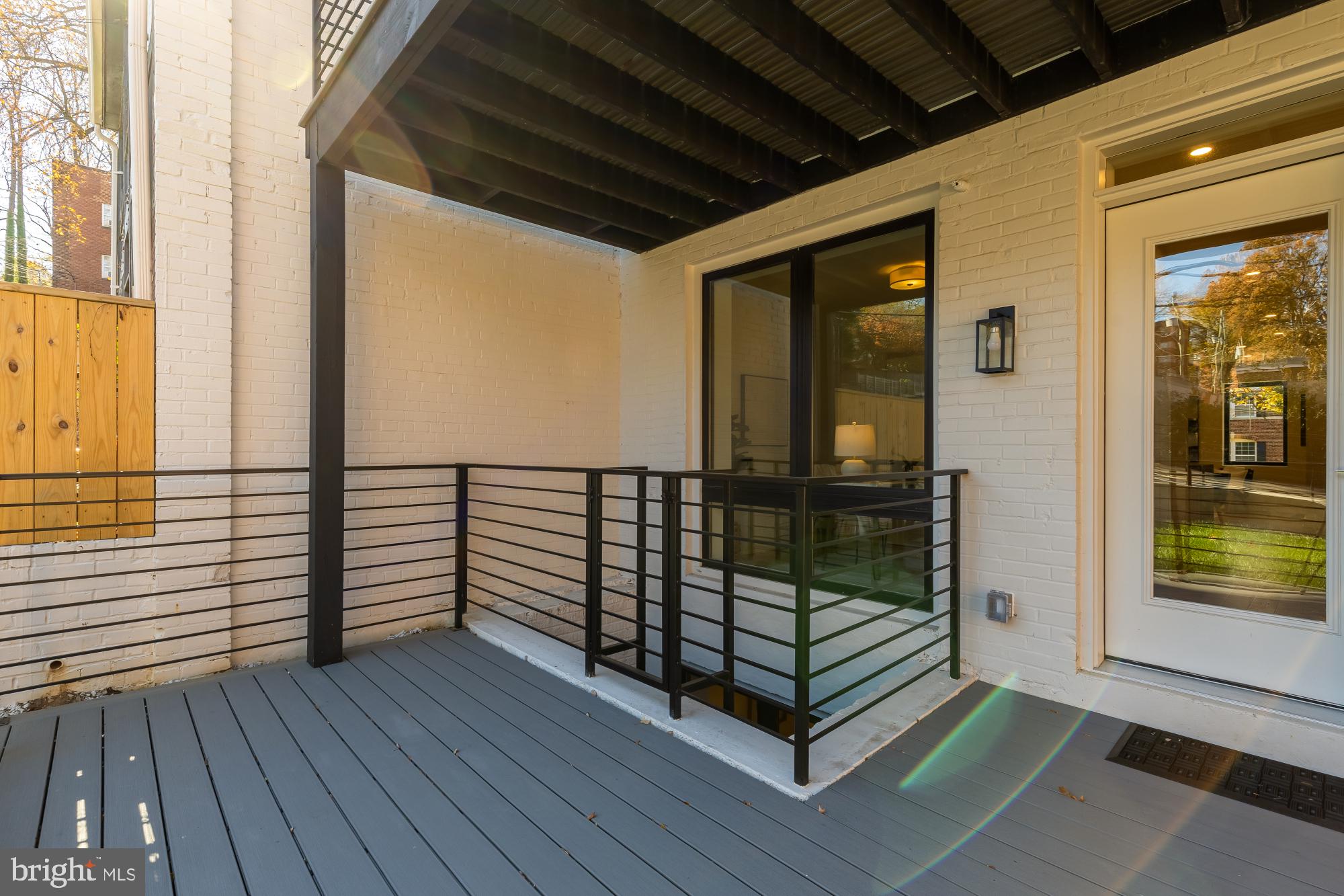2647 41st Street Northwest, Unit 2 Washington, DC 20007 - Photo 13 of 31 a view of a balcony with wooden floor