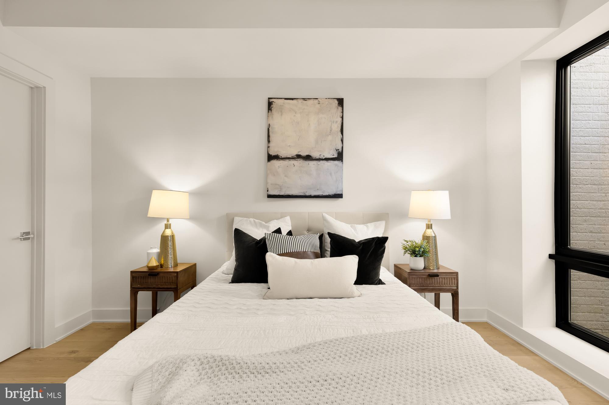 2647 41st Street Northwest, Unit 2 Washington, DC 20007 - Photo 16 of 31 a bedroom with a bed and a mirror