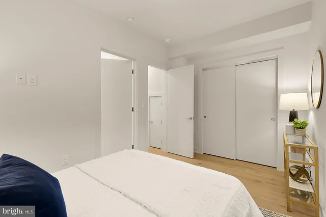 a bedroom with a bed and a cabinet
