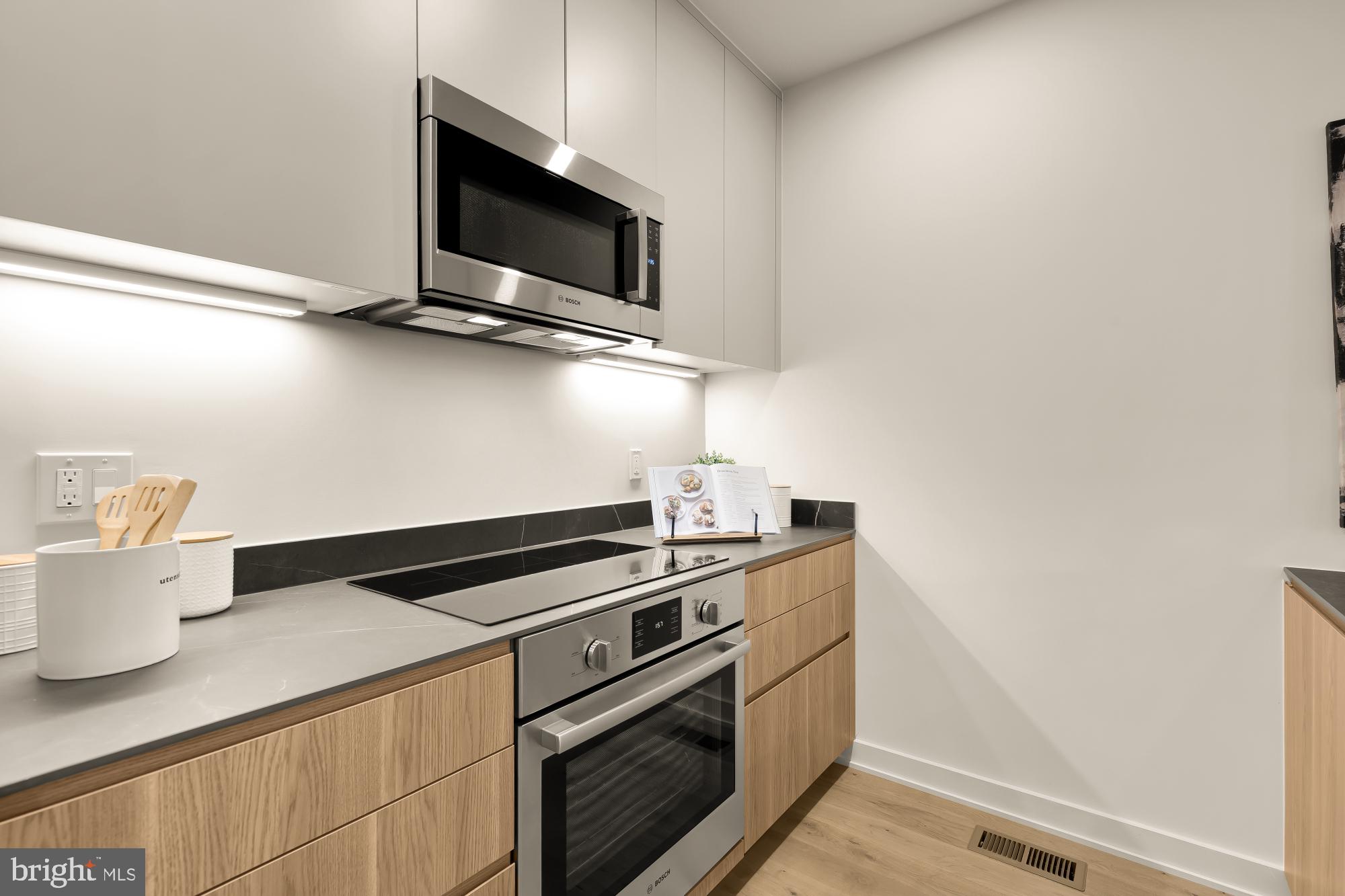 2647 41st Street Northwest, Unit 2 Washington, DC 20007 - Photo 7 of 31 a kitchen with a stove and a microwave