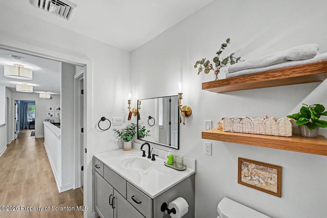 100 Highland Road Moscow, PA 18444 - Photo 64 of 85 a bathroom with a sink a mirror and a toilet