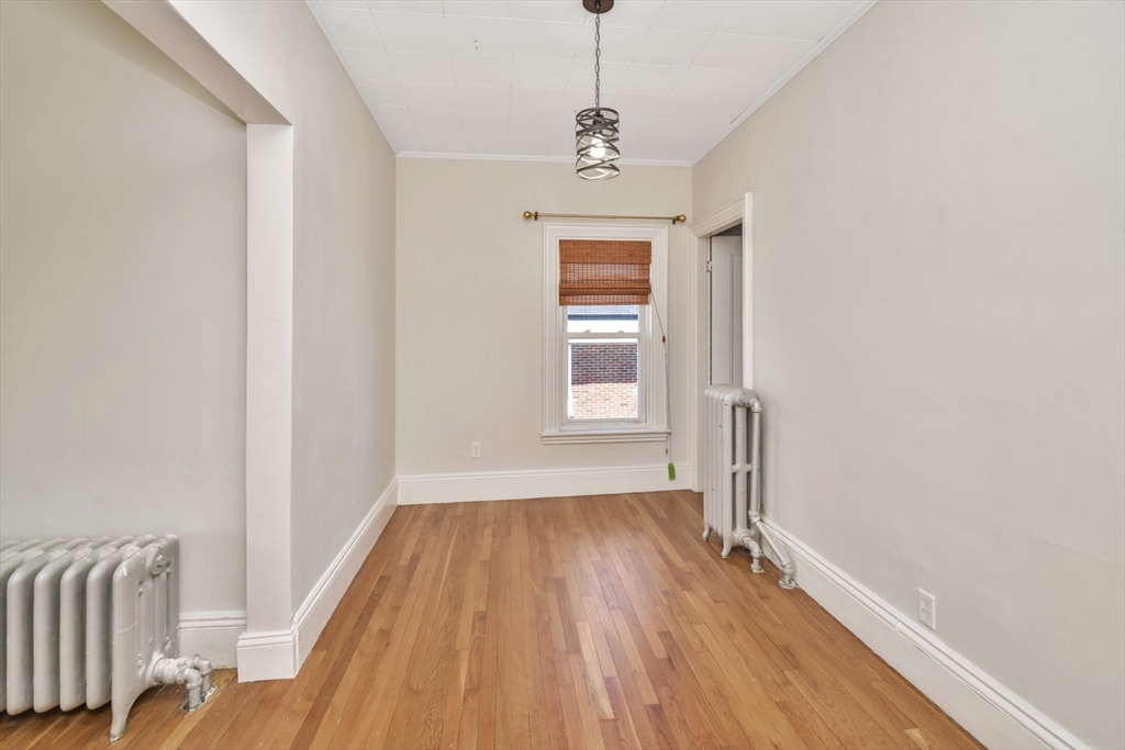 492 Metropolitan Avenue, Unit 2 Boston, MA 02136 - Photo 5 of 15 a very nice looking room with wooden floor and windows