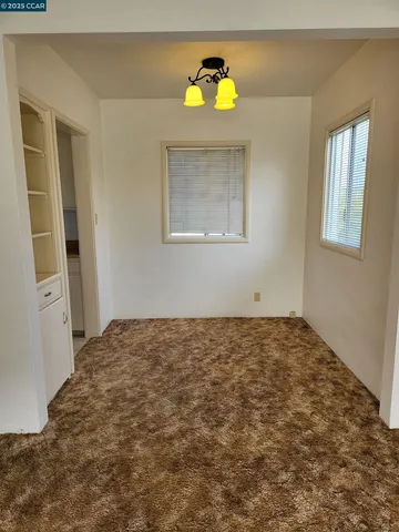 a view of an empty room and window