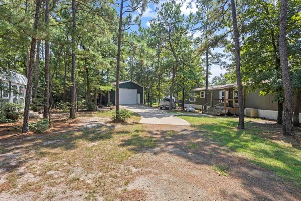 a view of a house with a tree