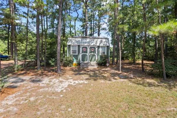 a view of a tree in front of a house