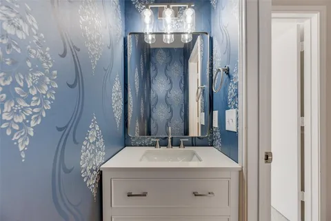 a view of an empty room with a ceiling fan