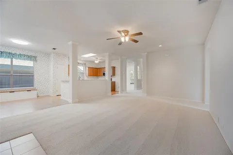 an empty room with a empty space and windows