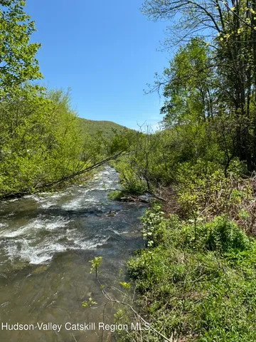 a view of a lake with beach
