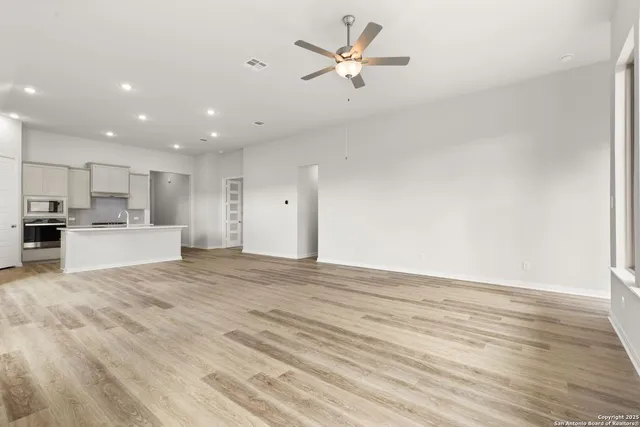a view of a kitchen with a sink and a stove