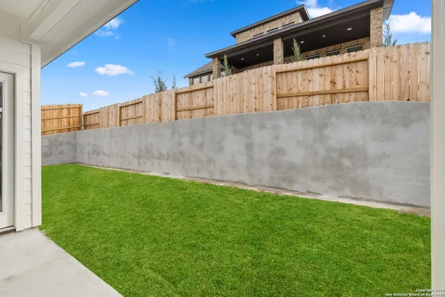 a view of backyard with cabin