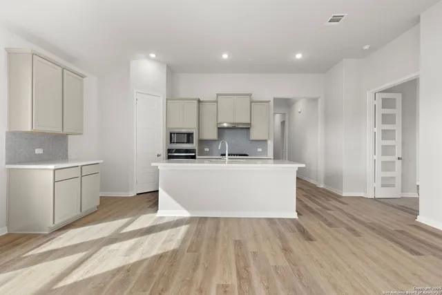 a view of kitchen with wooden floor