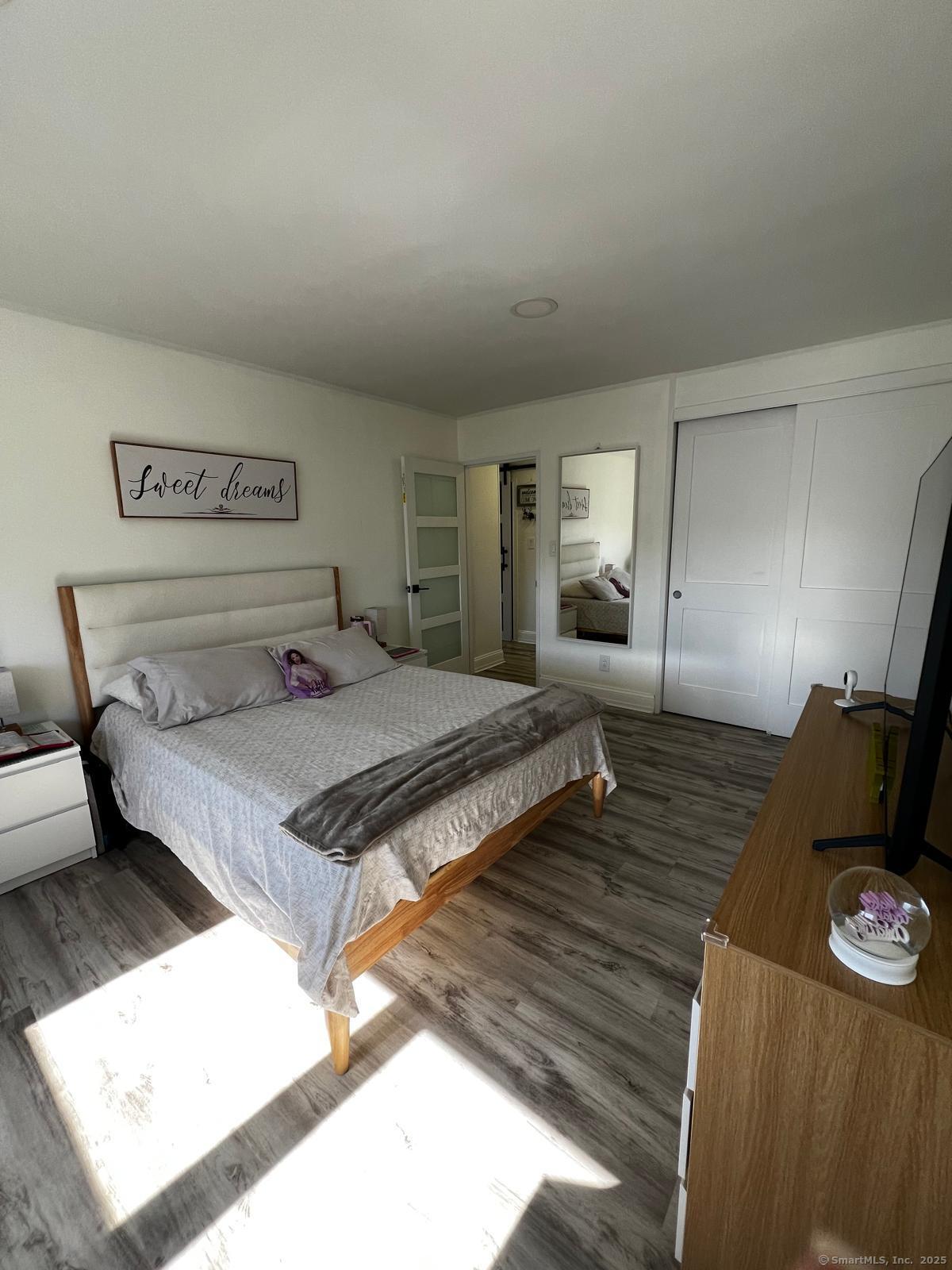 2370 North Avenue, Unit 3F Bridgeport, CT 06604 - Photo 17 of 25 a bedroom with a bed and window