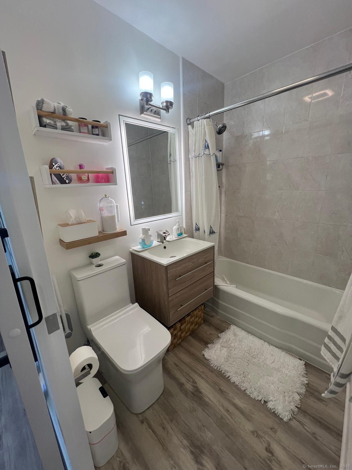 2370 North Avenue, Unit 3F Bridgeport, CT 06604 - Photo 19 of 25 a bathroom with a sink toilet tub and shower