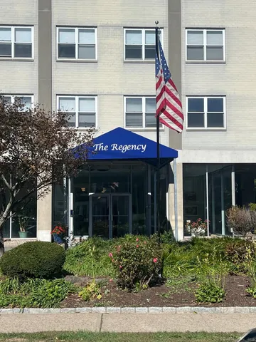 a view of a brick building with many windows