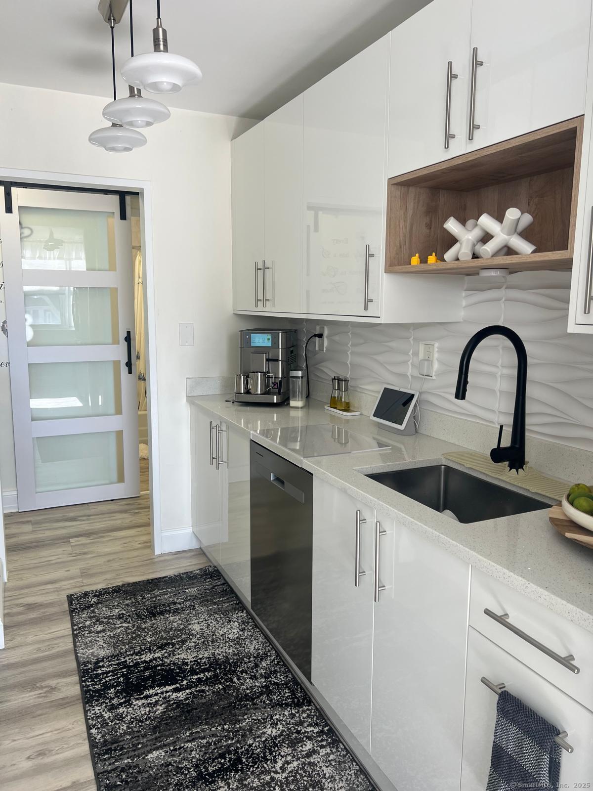 2370 North Avenue, Unit 3F Bridgeport, CT 06604 - Photo 8 of 25 a kitchen with a sink cabinets and appliances