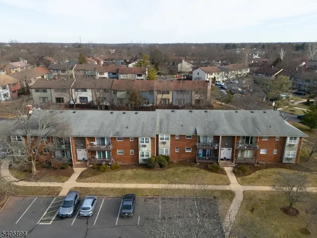 an aerial view of a house with swimming pool