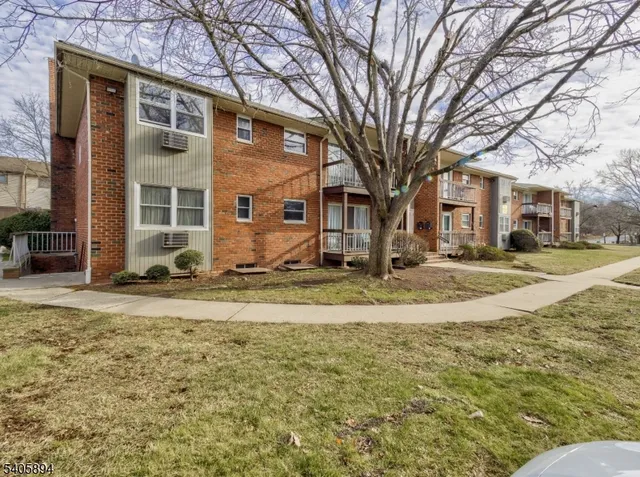a view of a house with snow on the tree