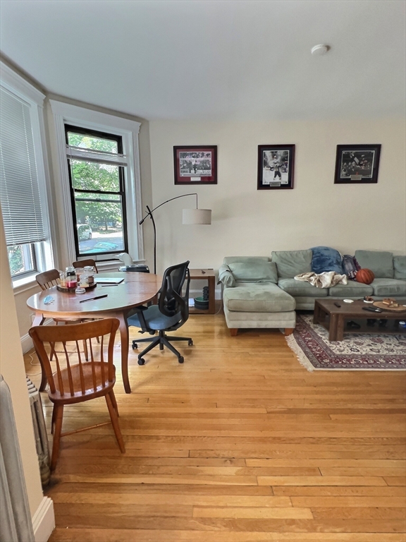 397 Harvard Street, Unit 2 Brookline, MA 02446 - Photo 1 of 1 a living room with furniture and a window