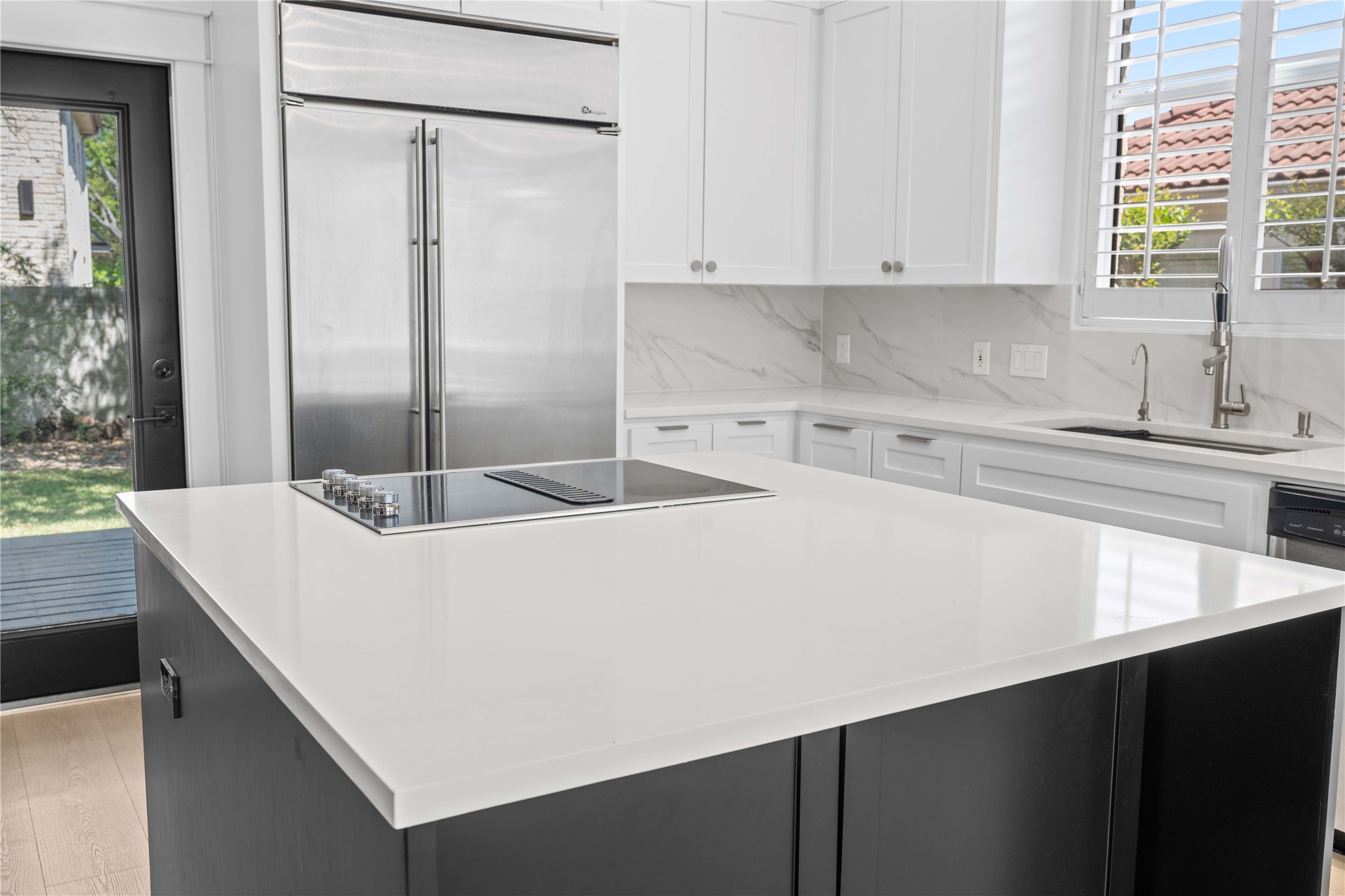 11 Treehaven Lane The Hills, TX 78738 - Photo 13 of 40 a kitchen with a sink a refrigerator and window