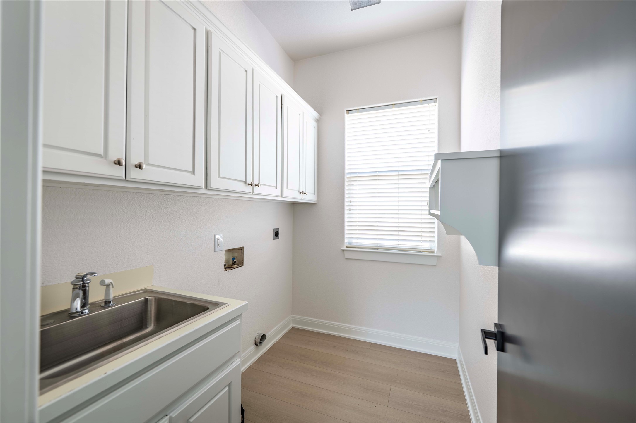 11 Treehaven Lane The Hills, TX 78738 - Photo 18 of 40 a view of a kitchen sink and cabinets