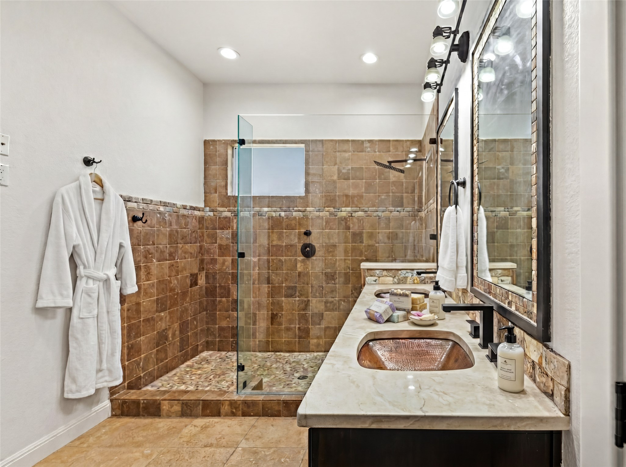 11 Treehaven Lane The Hills, TX 78738 - Photo 21 of 40 a bathroom with a sink a mirror and shower