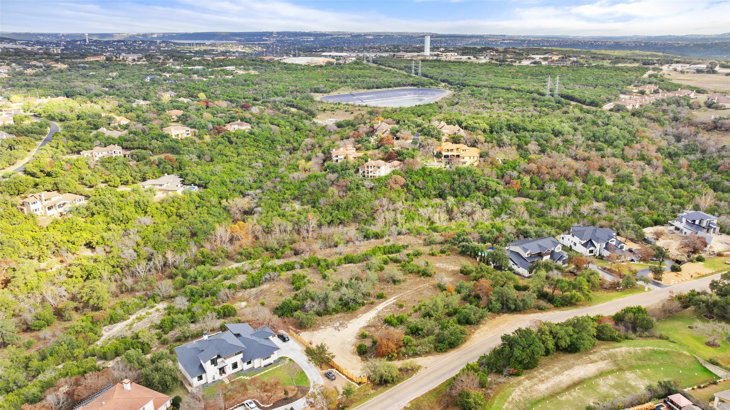 16130 Clara Van Street Austin, TX 78734 - Photo 3 of 9 Perched on a verdant hillside, this elevated lot offers breathtaking views of the surrounding landscape.
