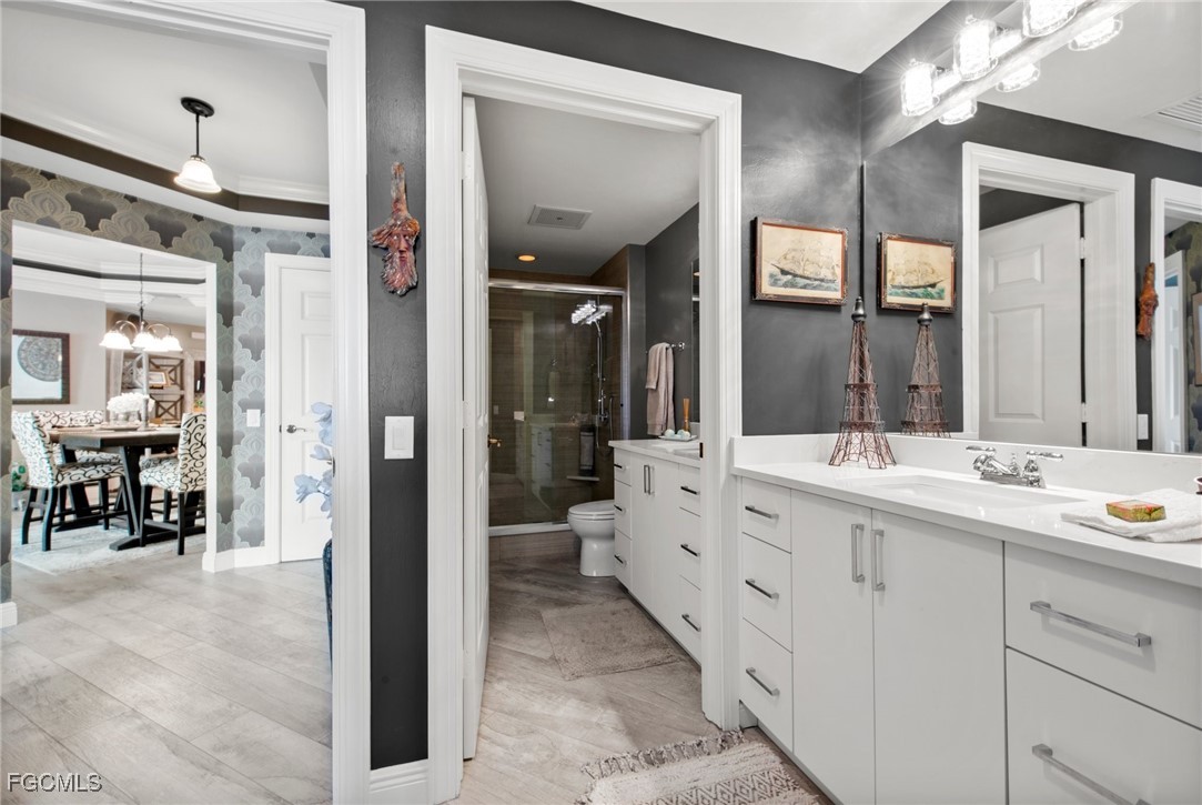 2745 First Street, Unit 1602 Fort Myers, FL 33916 - Photo 27 of 49 a bathroom with a double vanity sink and a mirror