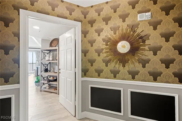 a view of a hallway and wooden floor