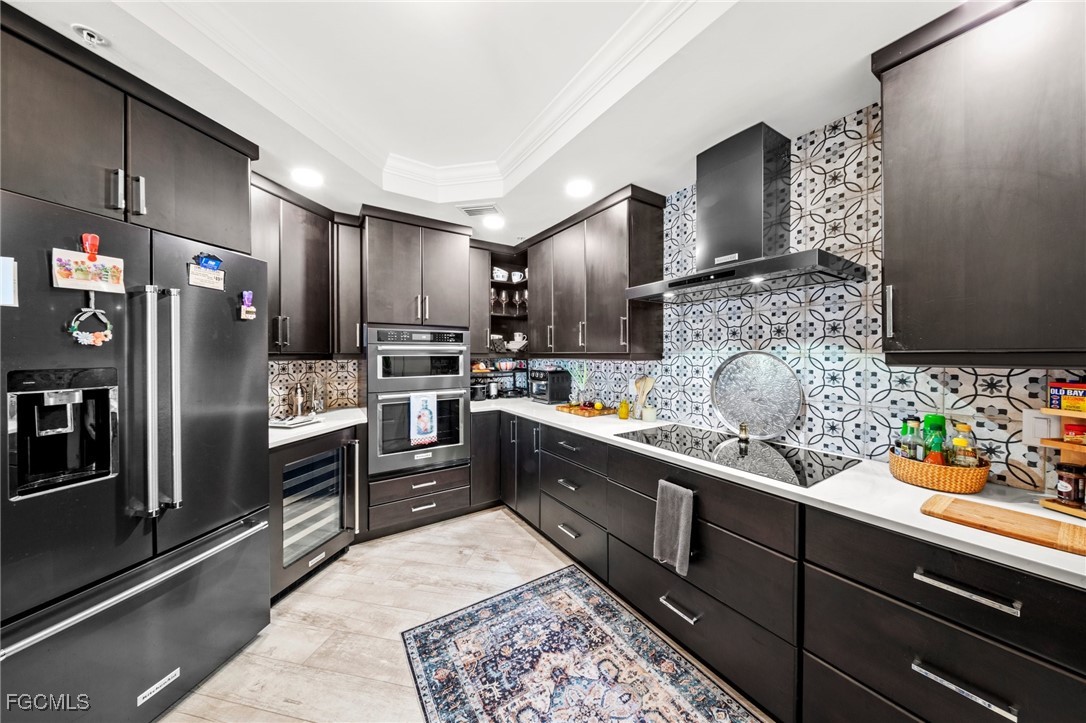 2745 First Street, Unit 1602 Fort Myers, FL 33916 - Photo 9 of 49 a kitchen with granite countertop stainless steel appliances and counter space