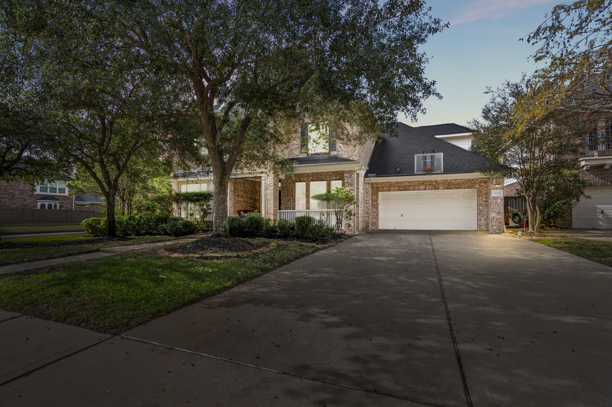 10203 Earlington Manor Drive Spring, TX 77379 - Photo 1 of 50 a front view of a house with a yard and garage