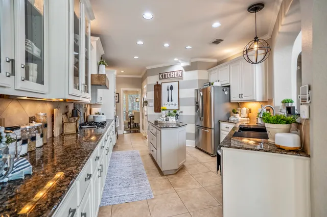 a living room with furniture fireplace and wooden floor