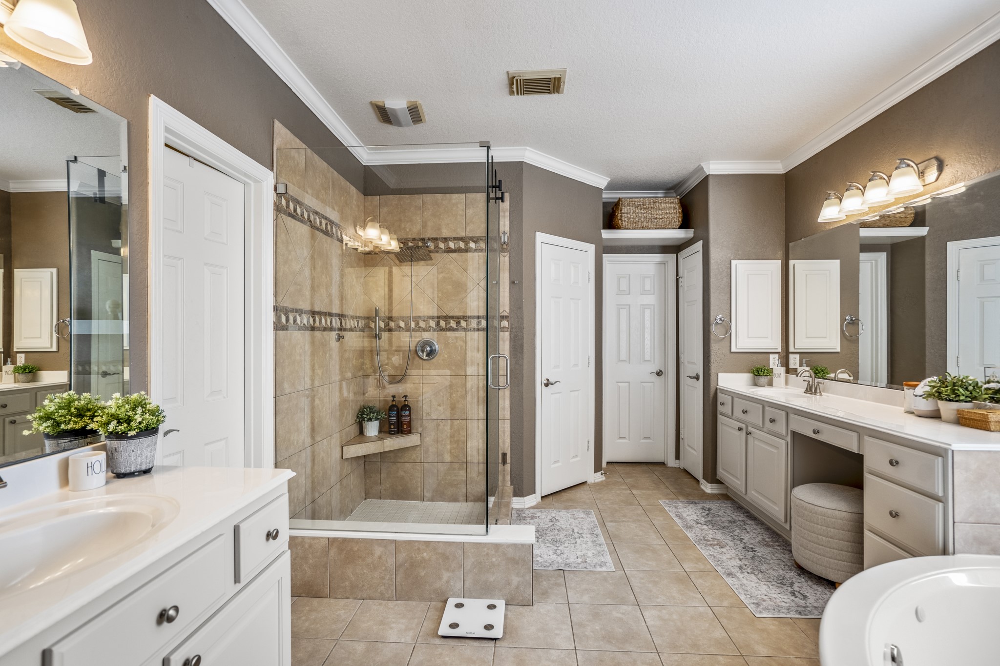 10203 Earlington Manor Drive Spring, TX 77379 - Photo 18 of 50 a bathroom with a granite countertop sink a toilet a mirror and shower