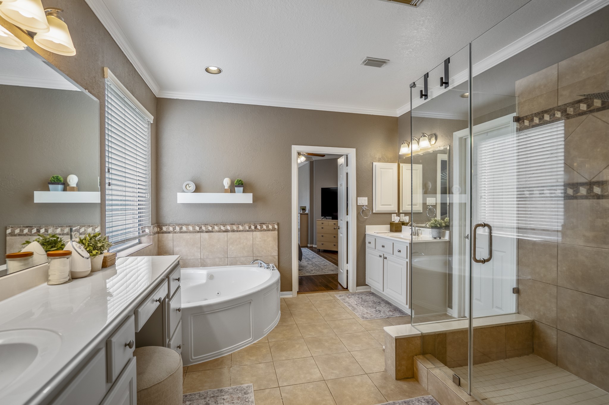 10203 Earlington Manor Drive Spring, TX 77379 - Photo 19 of 50 a bathroom with a granite countertop sink mirror bathtub and shower
