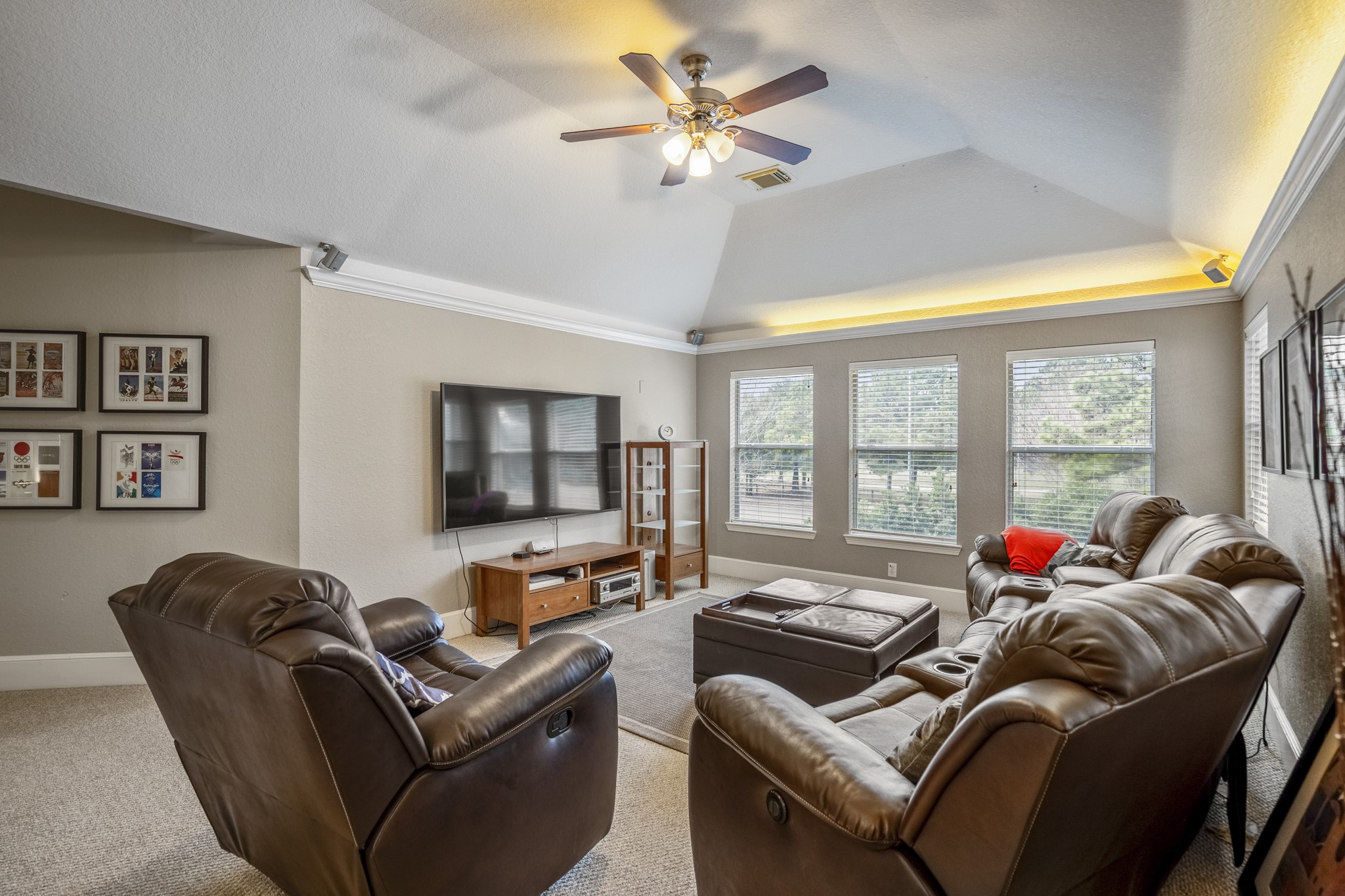 10203 Earlington Manor Drive Spring, TX 77379 - Photo 22 of 50 a living room with furniture ceiling fan and a window