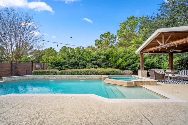 a view of swimming pool with a patio