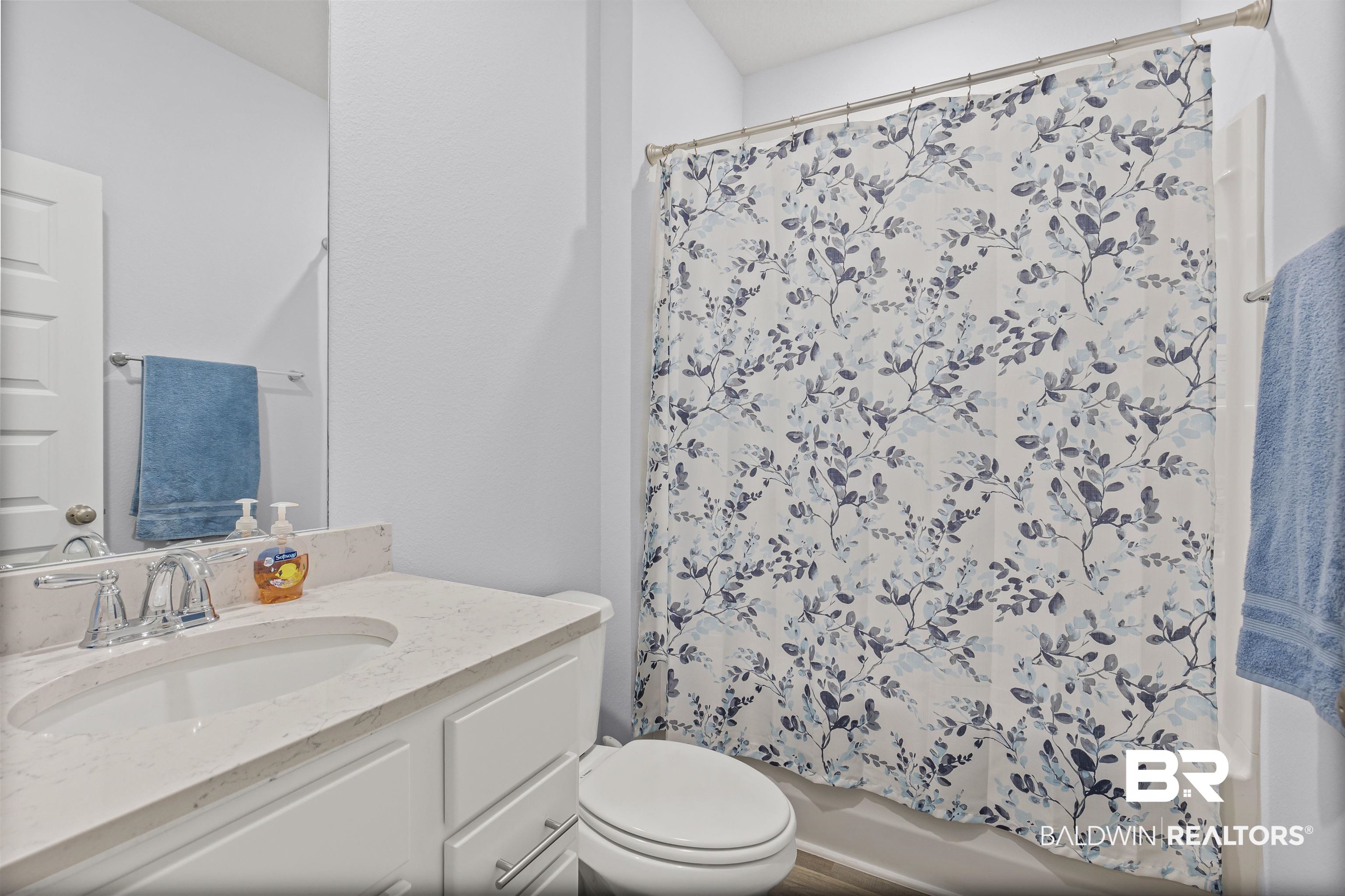 10564 Heirloom Road South Mobile, AL 36608 - Photo 20 of 24 Bathroom featuring shower / bath combo with shower curtain and vanity