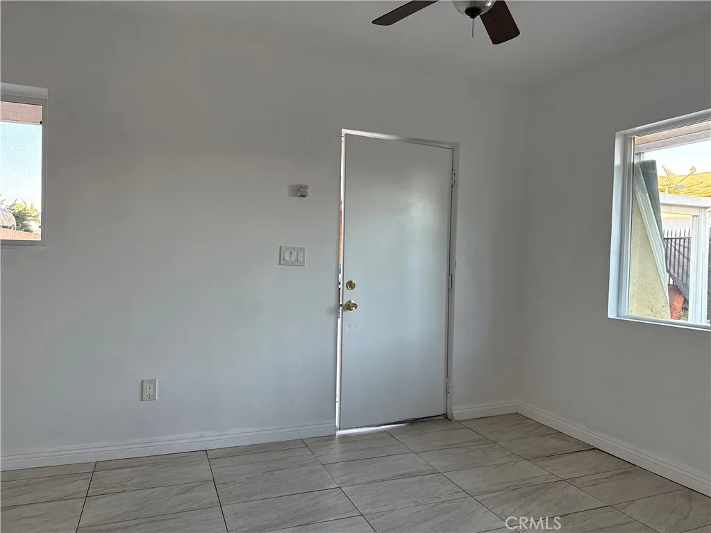 4118 East San Vincente Street Compton, CA 90220 - Photo 8 of 15 an empty room with windows and closet