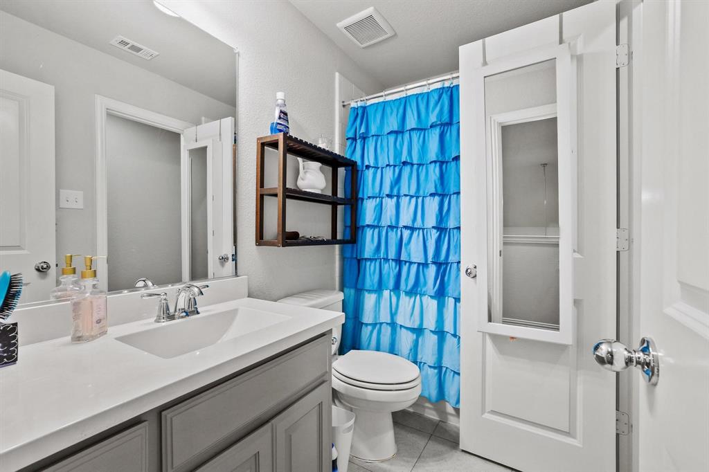 3500 Jersey Road Melissa, TX 75454 - Photo 24 of 40 a bathroom with a sink toilet vanity and shower