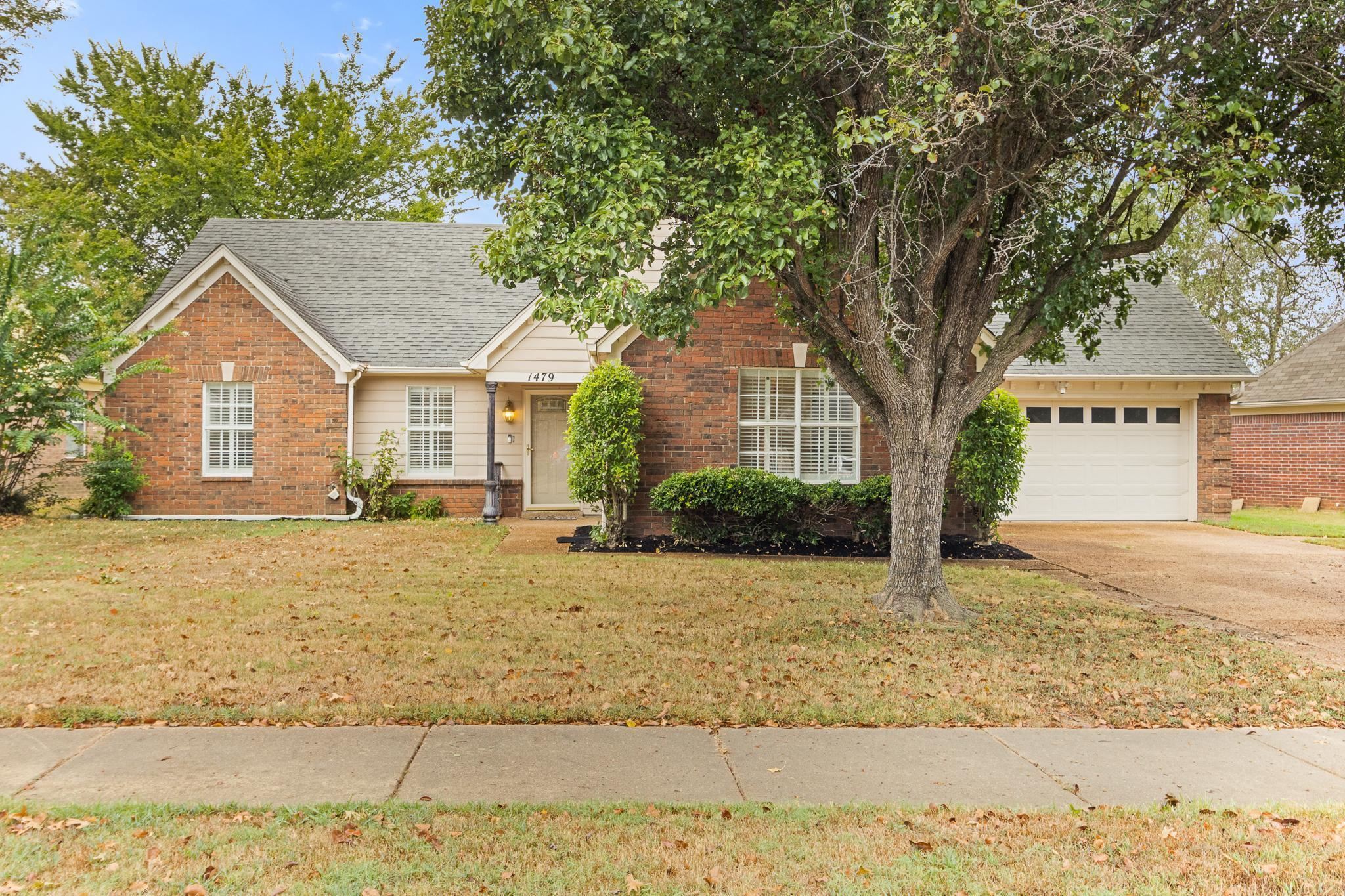 1479 Wolf Ridge Drive Collierville, TN 38017 - Photo 1 of 36 a front view of a house with a yard