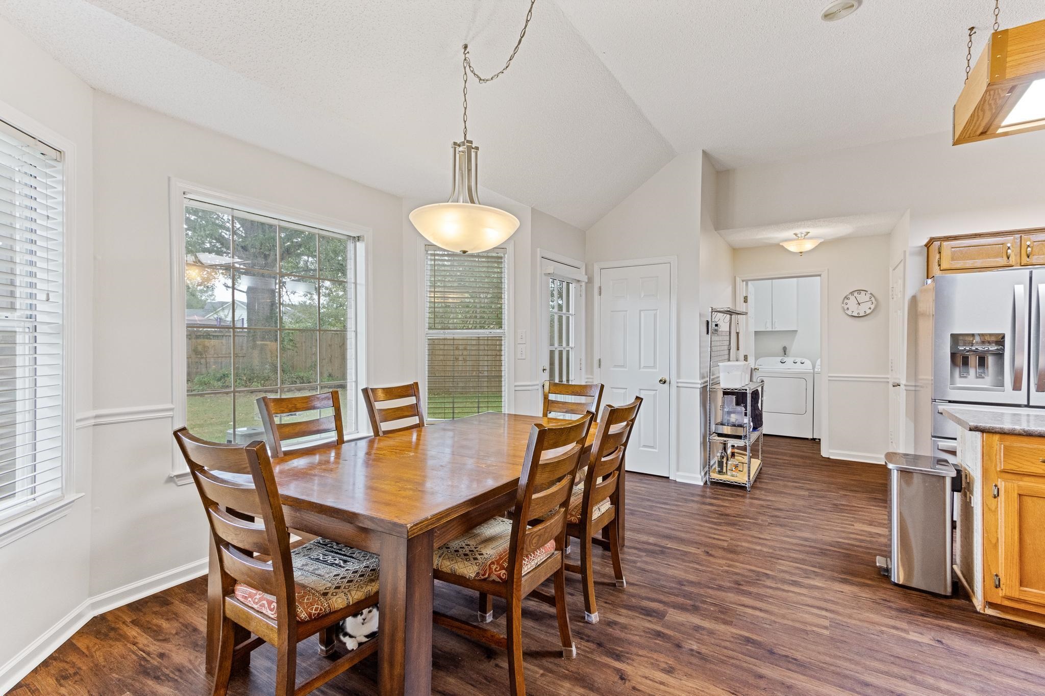 1479 Wolf Ridge Drive Collierville, TN 38017 - Photo 17 of 36 a view of a dining room with furniture and wooden floor