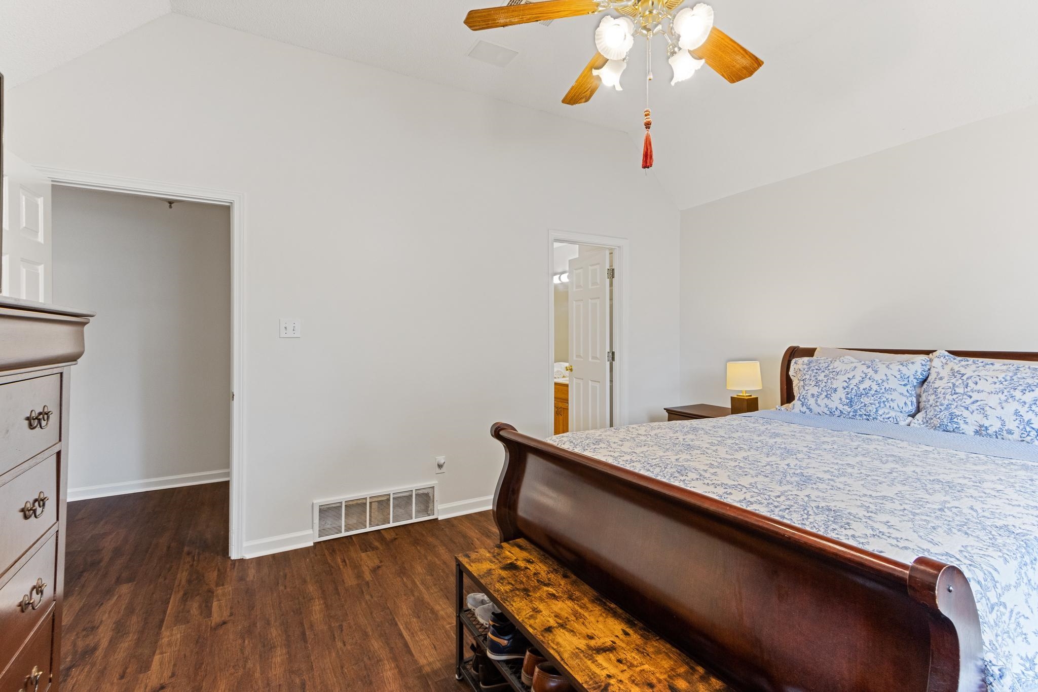1479 Wolf Ridge Drive Collierville, TN 38017 - Photo 21 of 36 a bedroom with a bed and a chandelier