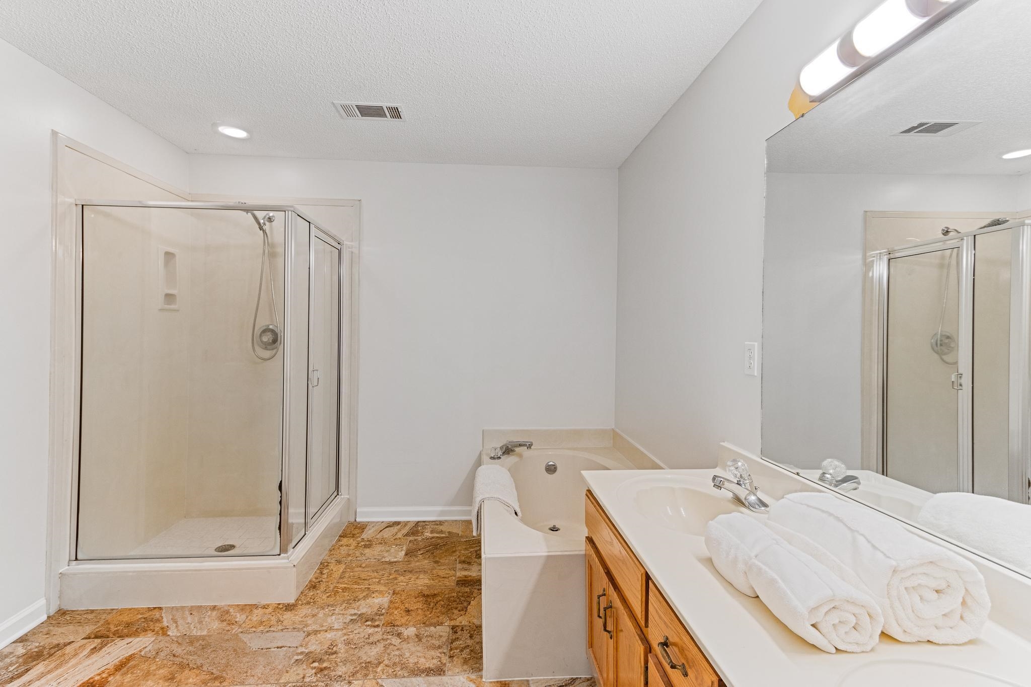 1479 Wolf Ridge Drive Collierville, TN 38017 - Photo 23 of 36 a en suite bathroom with a granite countertop sink and a mirror