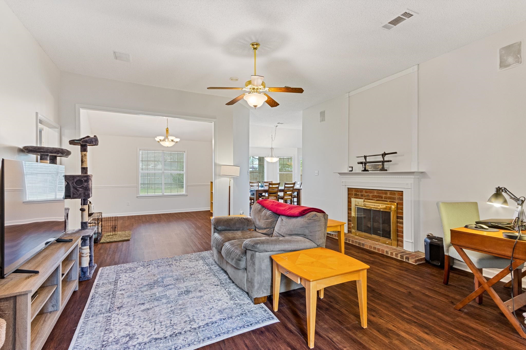 1479 Wolf Ridge Drive Collierville, TN 38017 - Photo 3 of 36 a living room with furniture and a fireplace
