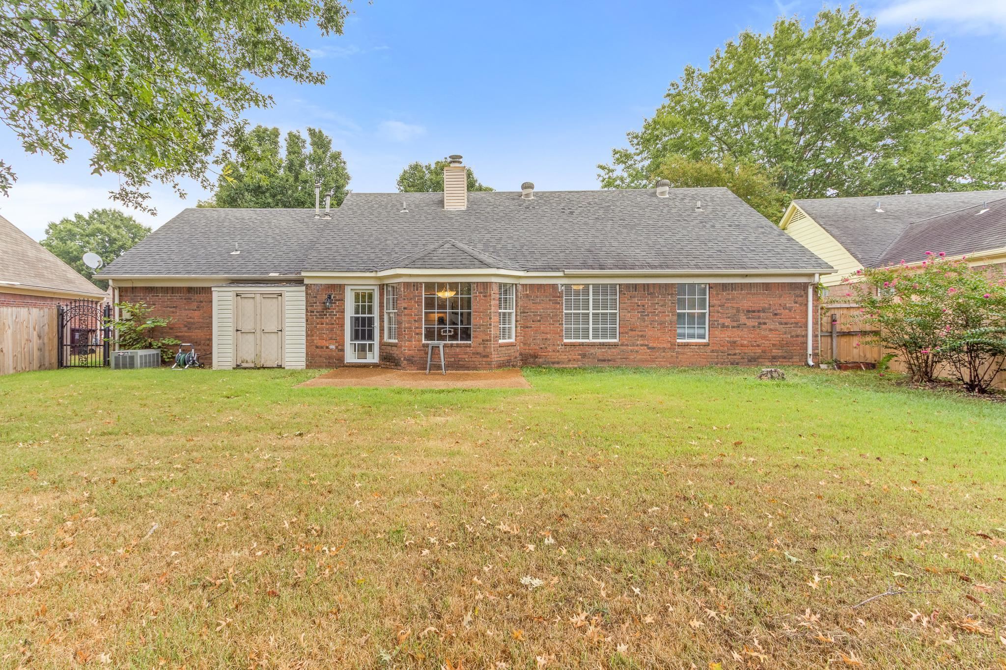 1479 Wolf Ridge Drive Collierville, TN 38017 - Photo 33 of 36 a front view of a house with a garden