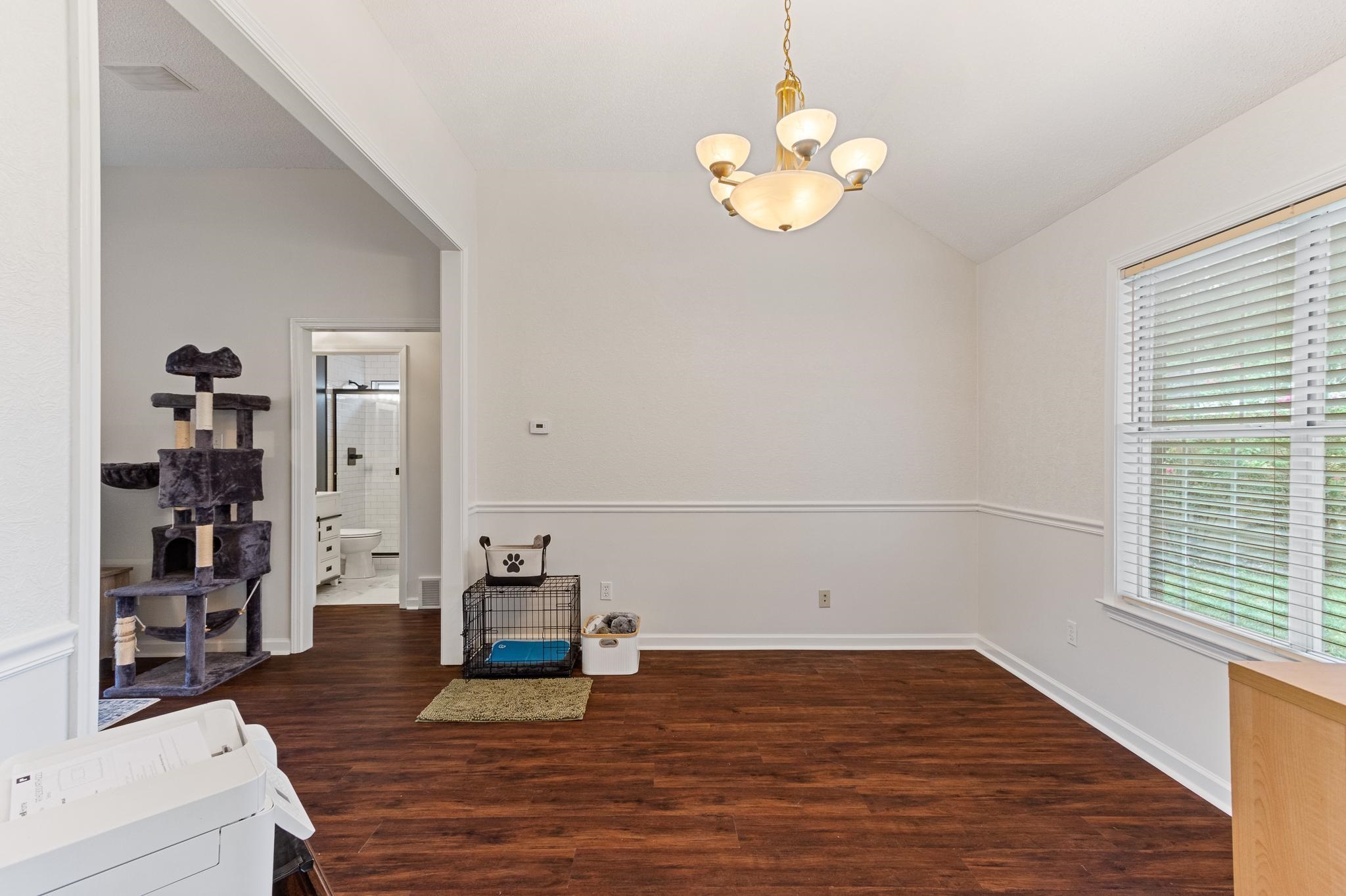 1479 Wolf Ridge Drive Collierville, TN 38017 - Photo 9 of 36 a view of empty room with wooden floor and window