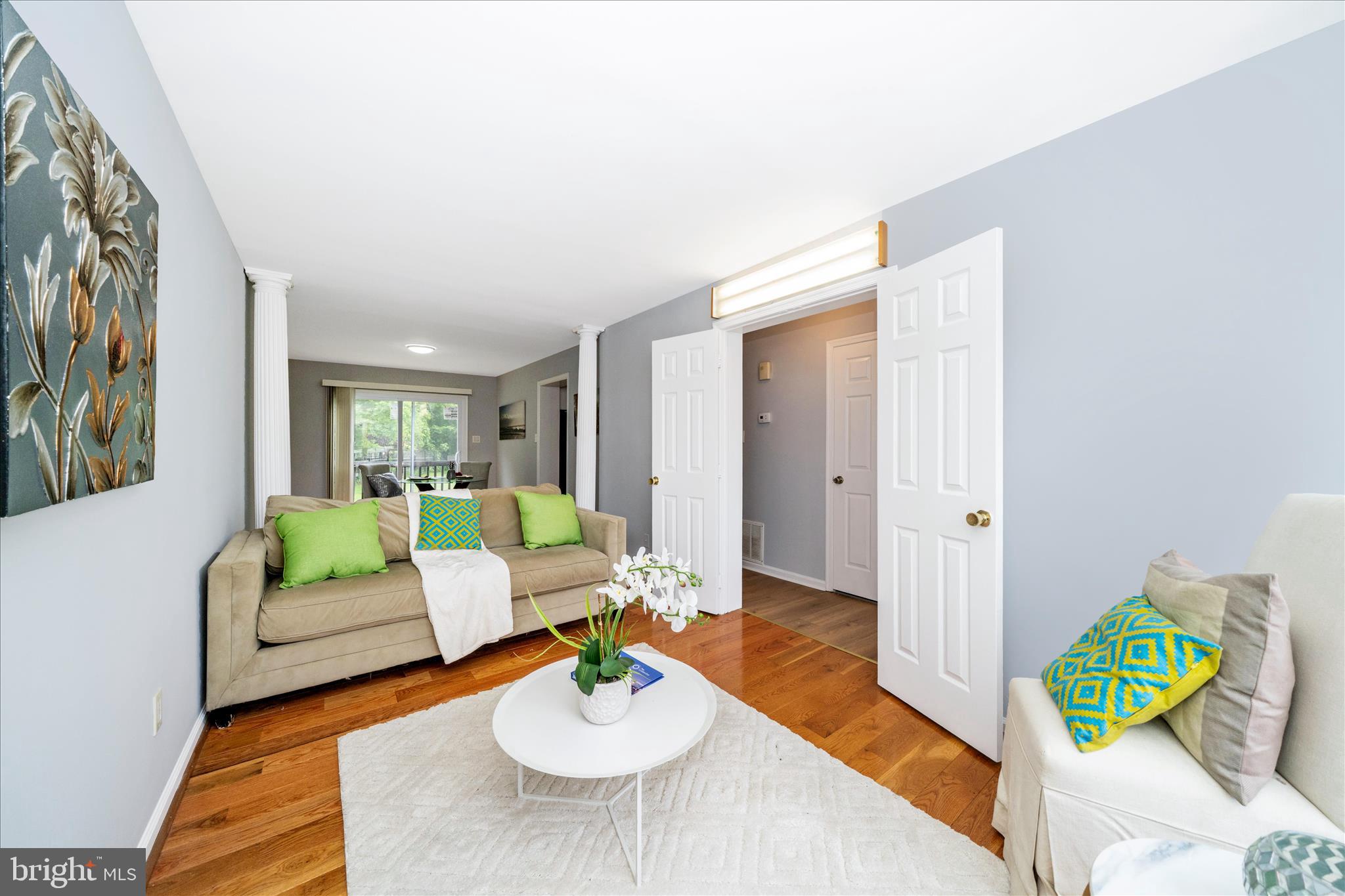 713 Seek Lane Silver Spring, MD 20912 - Photo 16 of 60 a living room with furniture and a wooden floor