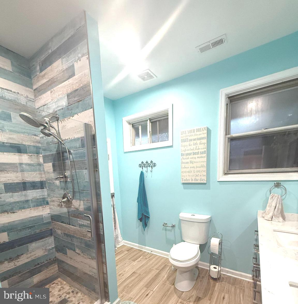 113 West Edgevale Road Baltimore, MD 21225 - Photo 13 of 41 a bathroom with a toilet and a shower